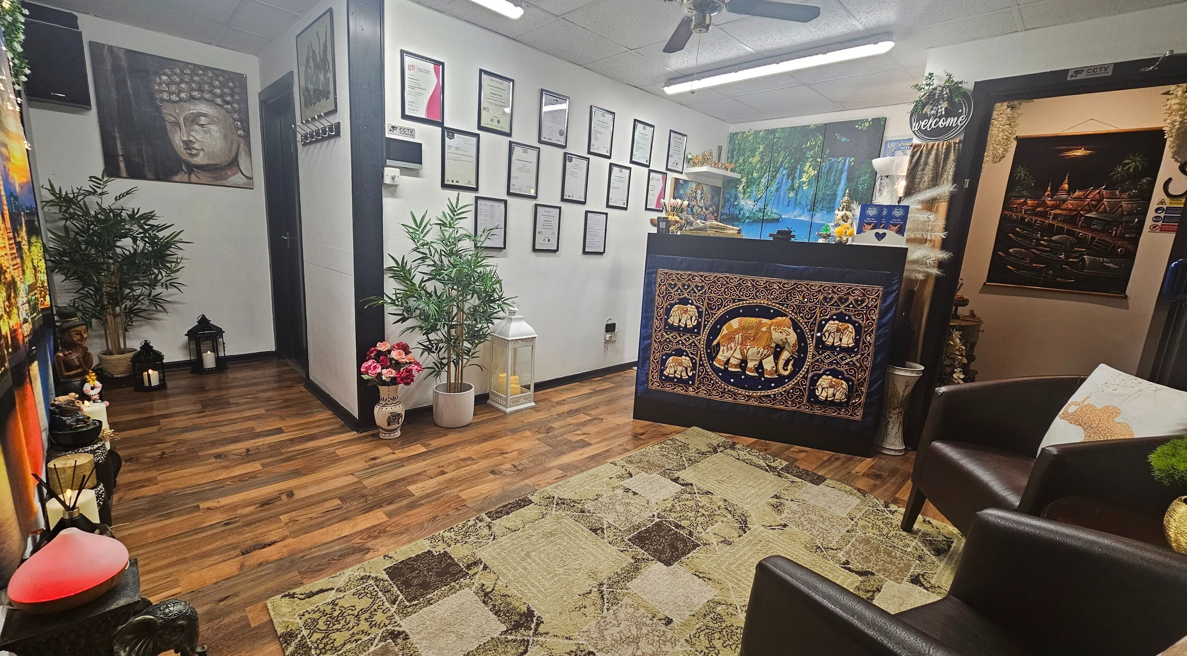 Tranquil reception at Blue Sky Thai Massage Ltd, Belfast, Northern Ireland, GB with elegant decor and certificates.
