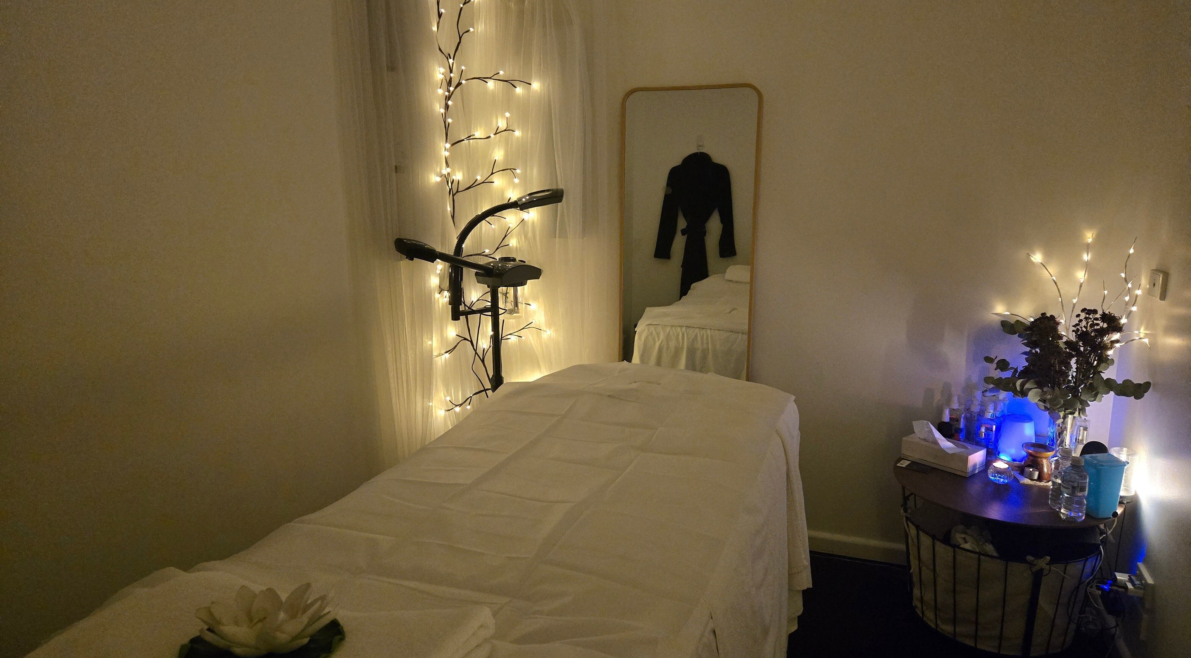 Calming therapy room at V.A. Spa Therapy, Prahran, Victoria, AU decorated with soft lights and a massage bed.