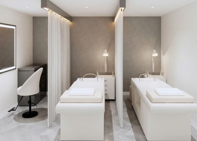 Luxury massage room at Sparadise, Calgary, Alberta, CA, featuring modern decor and a relaxing ambiance.