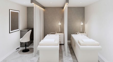 Luxury massage room at Sparadise, Calgary, Alberta, CA, featuring modern decor and a relaxing ambiance.