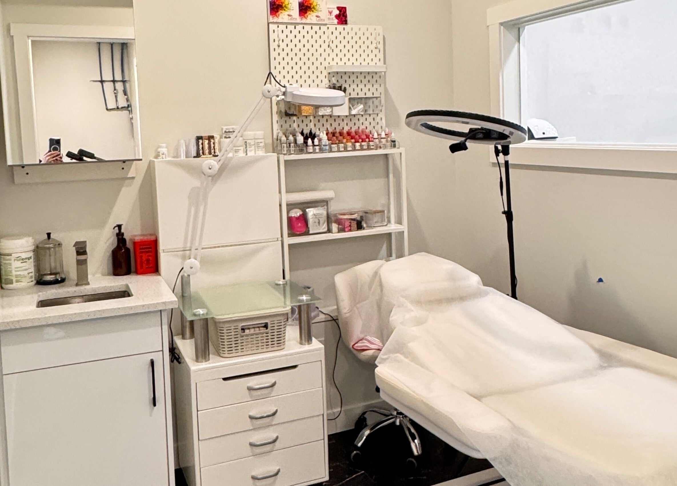 Treatment room at Sparadise, Calgary, Alberta, CA, featuring a comfortable bed and professional equipment.