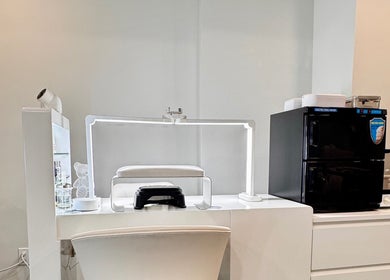 Modern nail station at Sparadise, Calgary, Alberta, CA, featuring minimalist white decor.