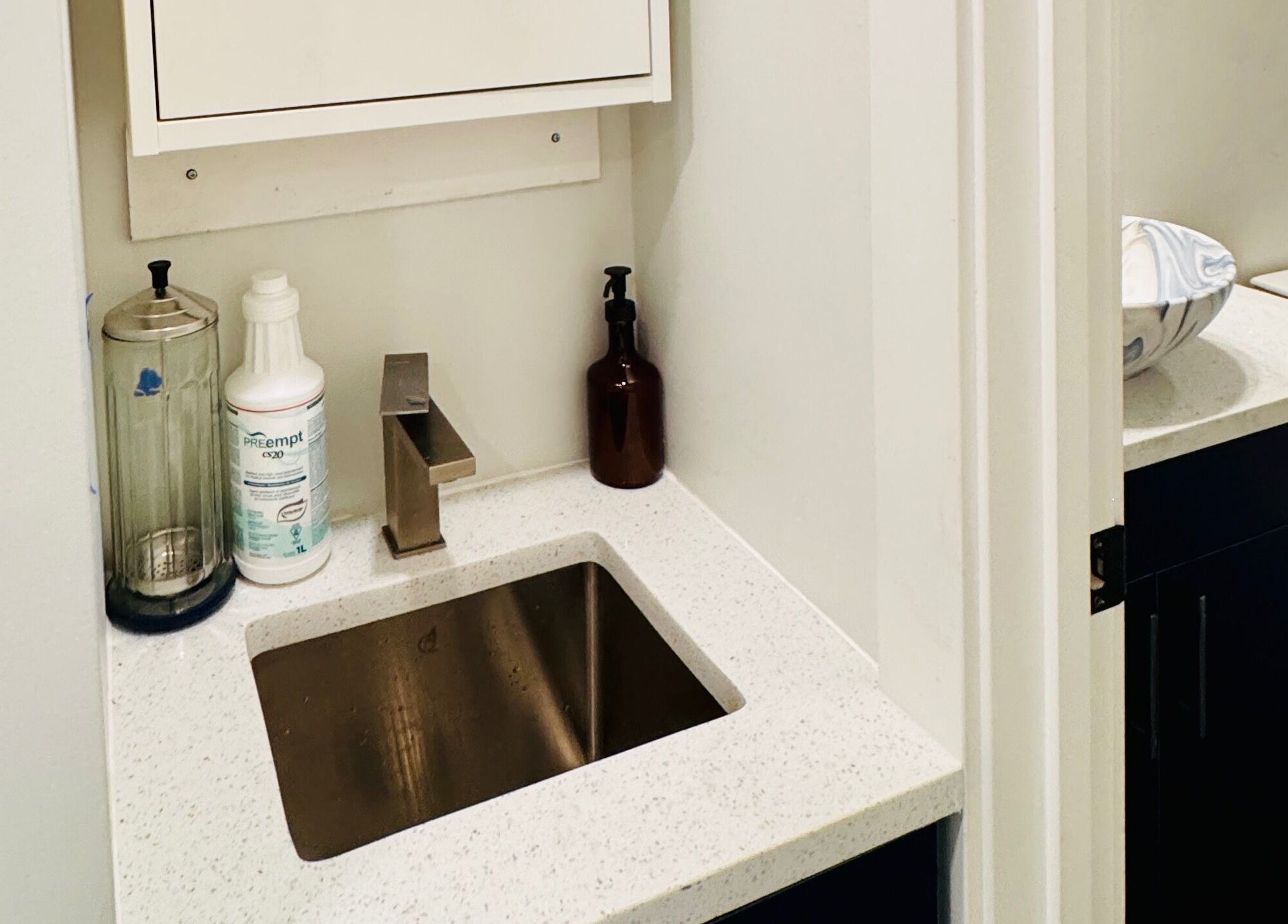 Modern sink area at Sparadise, Calgary, Alberta, CA, showcasing sleek design and cleanliness.