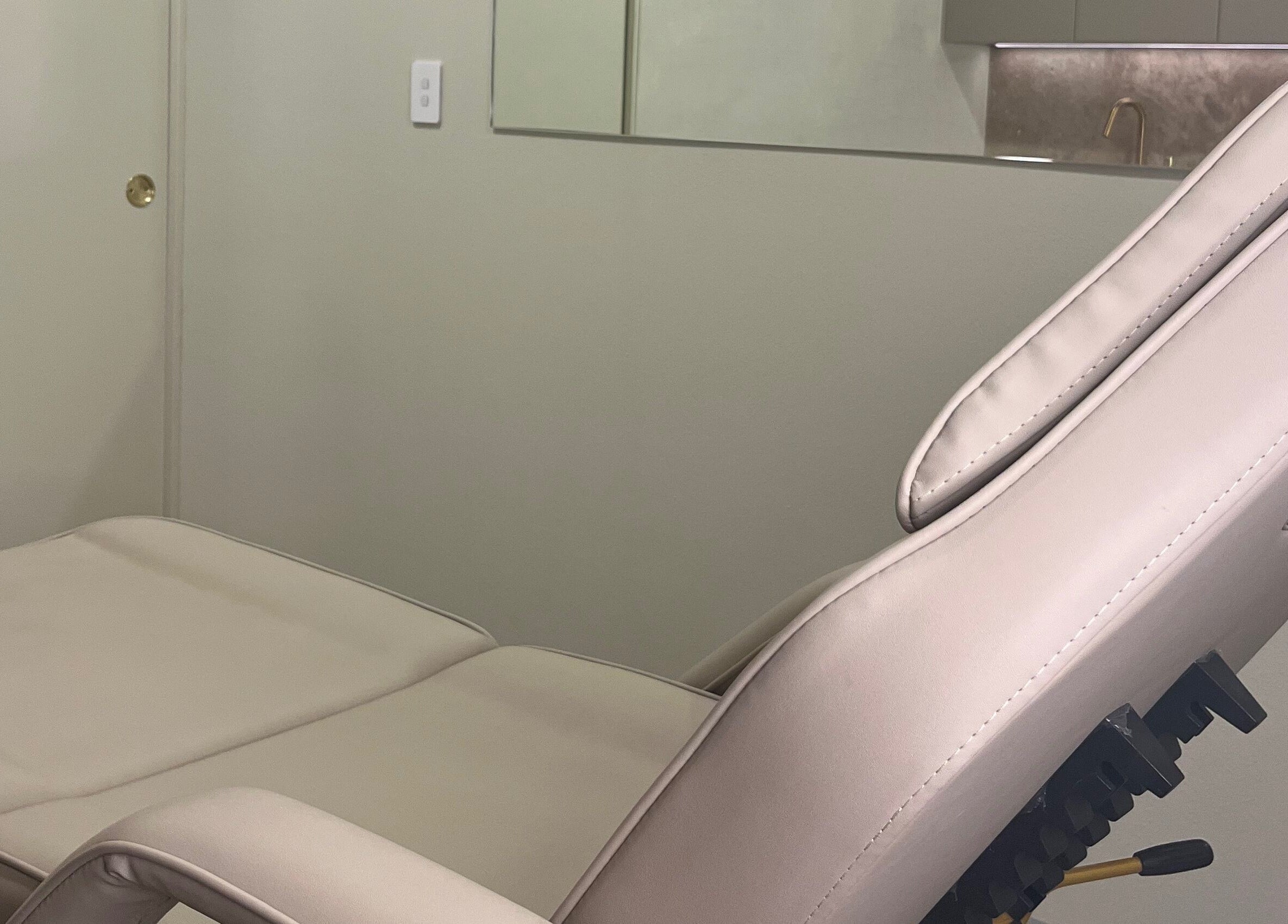 Luxurious treatment chair at Nadine Aesthetics, Pacific Pines, Queensland, AU offering comfort and relaxation.