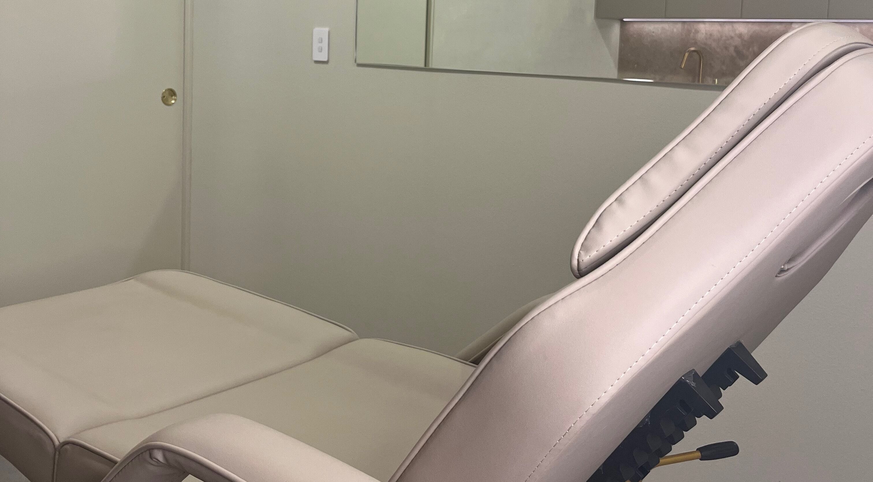 Luxurious treatment chair at Nadine Aesthetics, Pacific Pines, Queensland, AU offering comfort and relaxation.