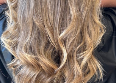 Elegant golden curls styled at Hannah Marie Hair Studio, Hurstbourne Tarrant, England, GB.