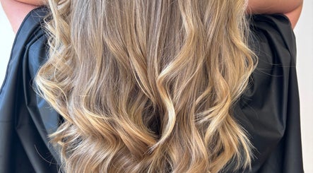 Elegant golden curls styled at Hannah Marie Hair Studio, Hurstbourne Tarrant, England, GB.
