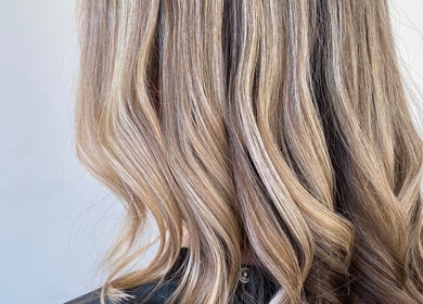 Blonde wavy hair styled at Hannah Marie Hair Studio, Hurstbourne Tarrant, England, GB.