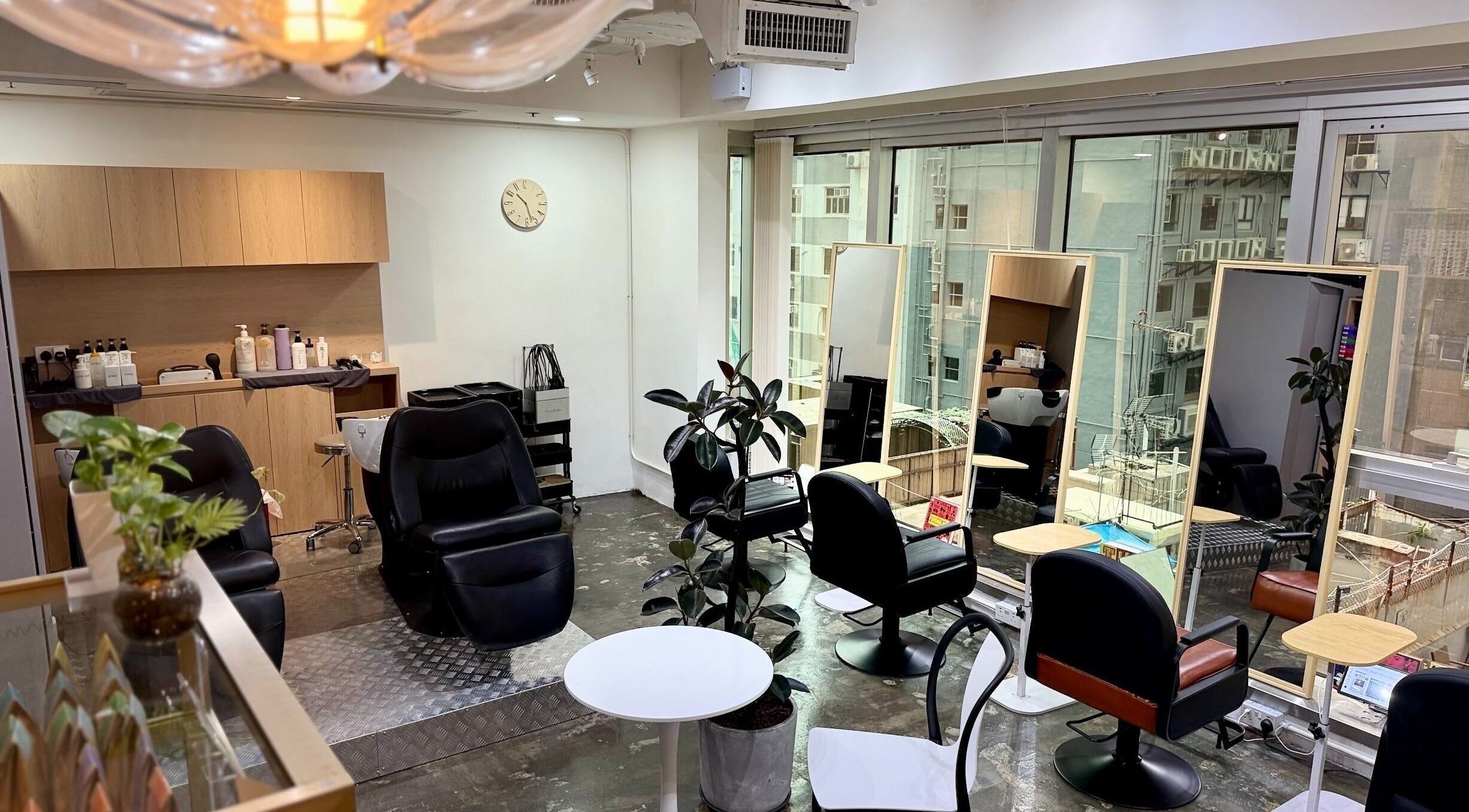 Modern chairs and mirrors at HASUHANA hair salon on Hong Kong Island, Hong Kong Island, HK.