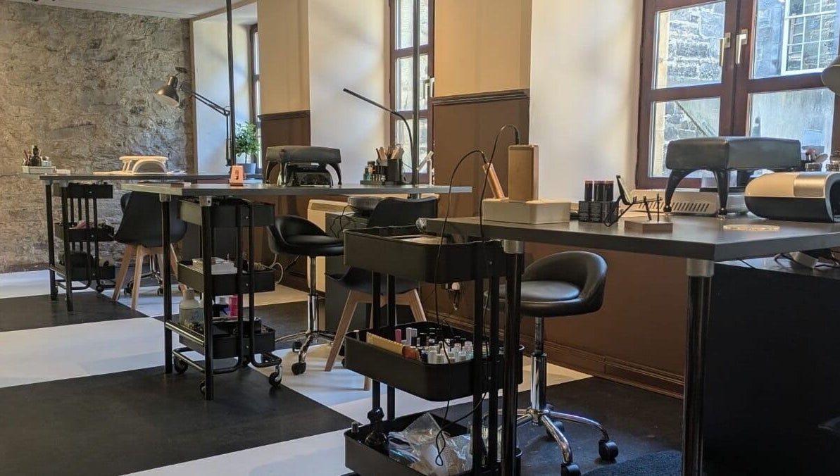 Modern nail studio setup at Claws and Pause, Edinburgh, Scotland, GB featuring sleek manicure stations.