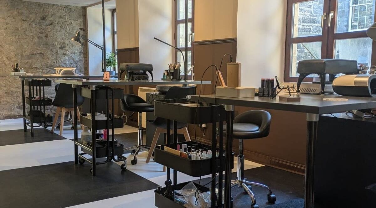 Modern nail studio setup at Claws and Pause, Edinburgh, Scotland, GB featuring sleek manicure stations.
