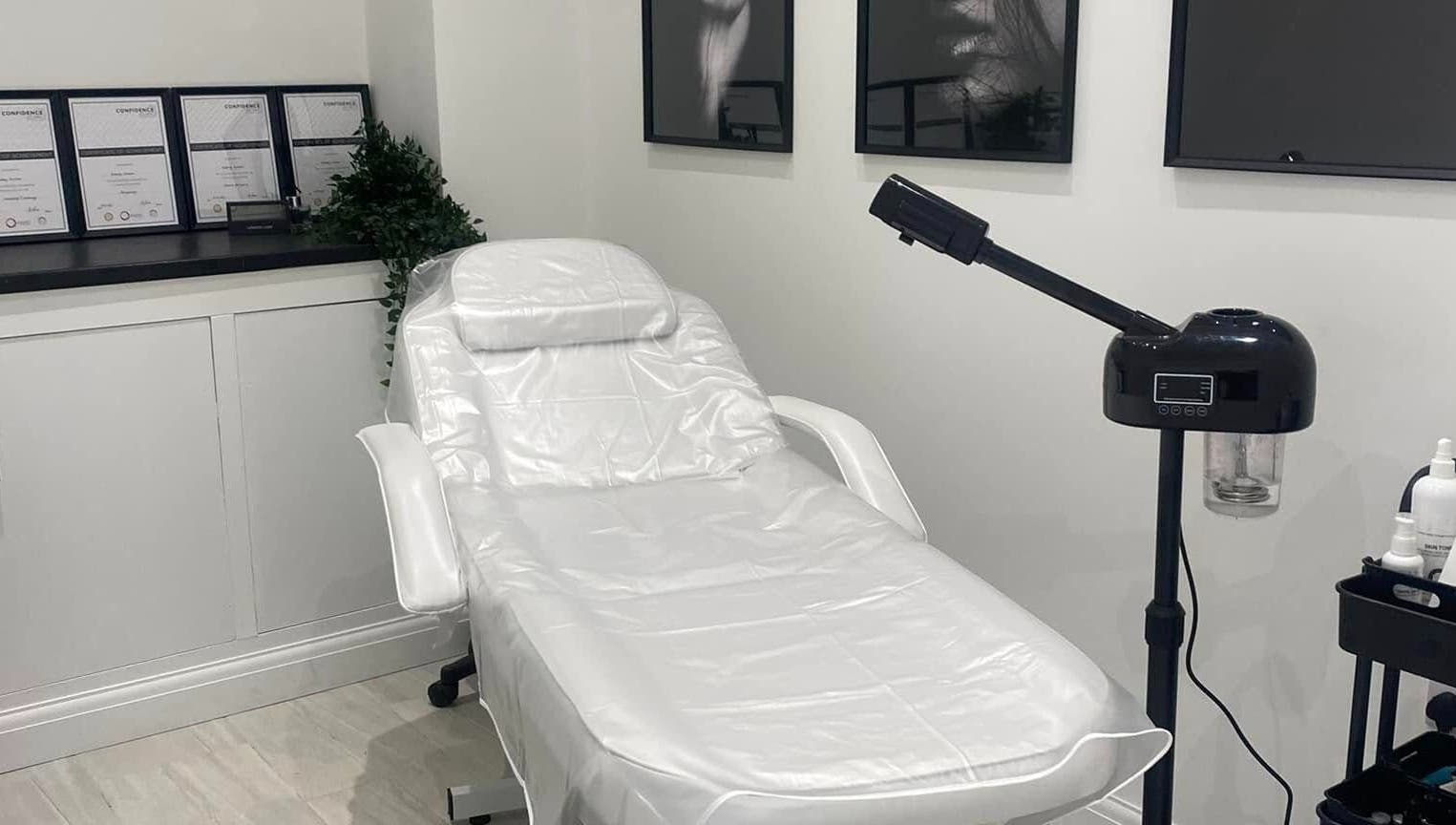 Relaxing treatment room at The Quartz Clinic, Hucknall, England, GB, featuring a sleek white therapy chair.