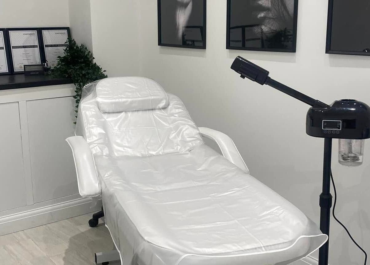 Relaxing treatment room at The Quartz Clinic, Hucknall, England, GB, featuring a sleek white therapy chair.