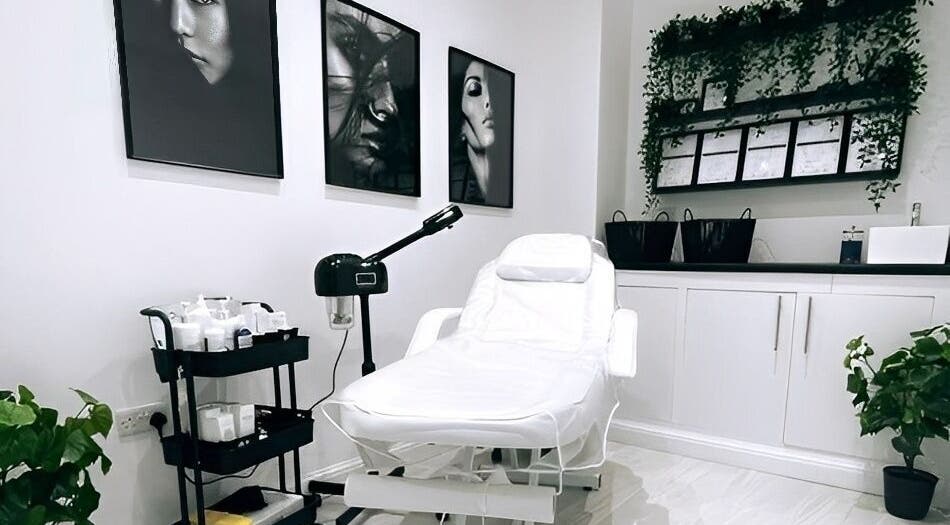 Relaxing treatment room at The Quartz Clinic, Hucknall, England, GB with a white spa chair and wall art.