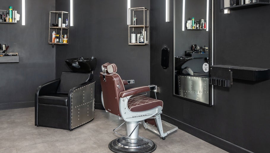 Chic barbershop interior with leather chair at Curfew Grooming Hackney Wick, London, England, GB.