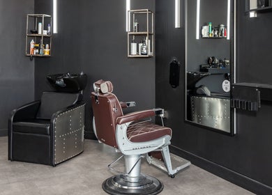 Chic barbershop interior with leather chair at Curfew Grooming Hackney Wick, London, England, GB.