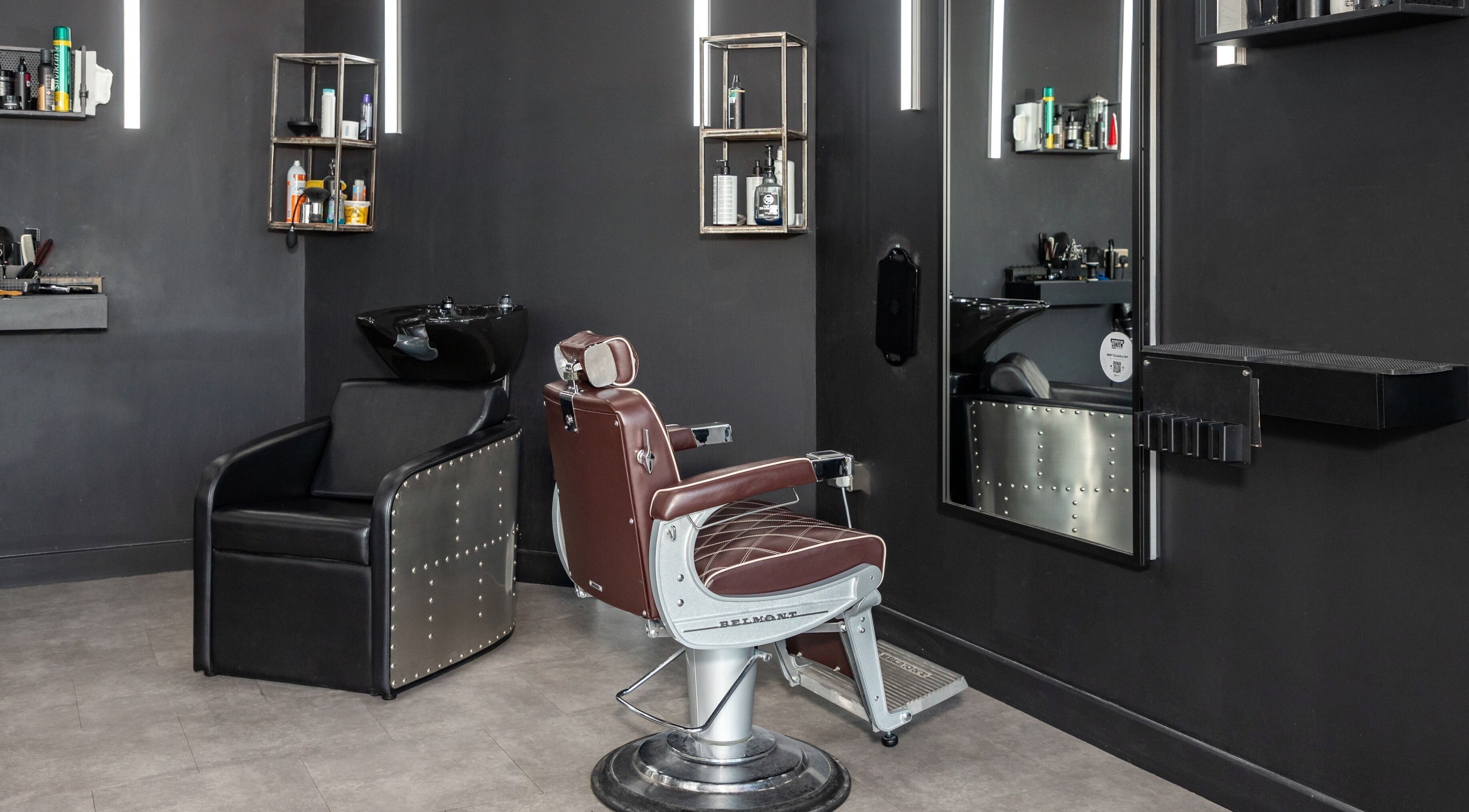 Chic barbershop interior with leather chair at Curfew Grooming Hackney Wick, London, England, GB.