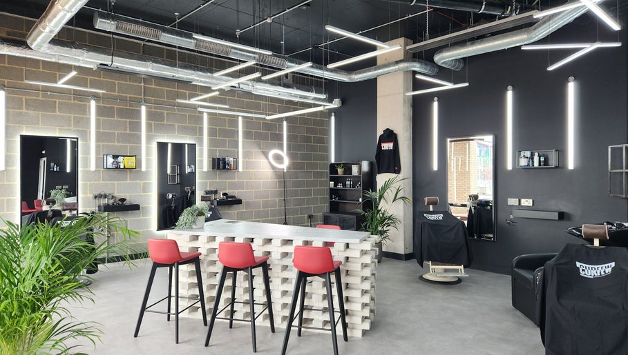 Interior of Curfew Grooming Wandsworth in London, England, GB with stylish decor and bright lighting.