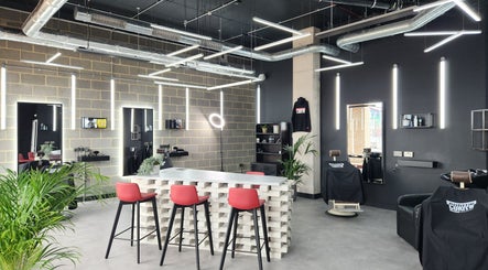Interior of Curfew Grooming Wandsworth in London, England, GB with stylish decor and bright lighting.
