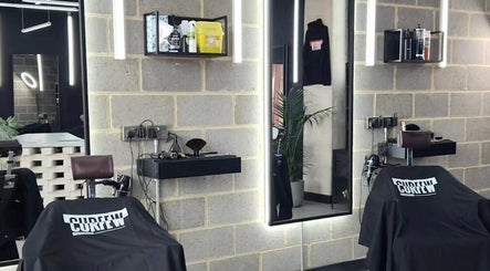 Sleek interior of Curfew Grooming Wandsworth, London, England, GB, showcasing expert barbershop design.