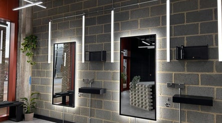 Chic salon interior at Curfew Grooming Wandsworth, London, England, GB, featuring contemporary decor and ambience.
