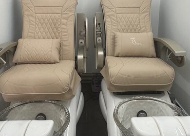 Comfortable pedicure chairs at Ks Nail Salon, London, England, GB, offering a relaxing experience.