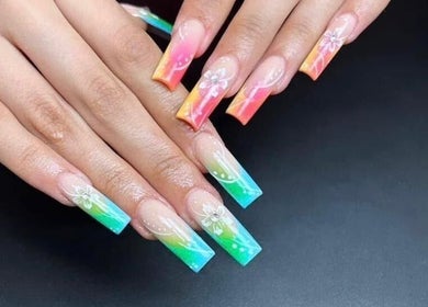 Colorful nail art design at Ks Nail Salon, London, England, GB showcasing detailed floral patterns.