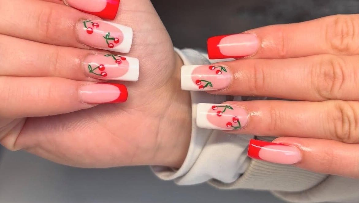 Vibrant cherry nail art at NAILHAUS, Halifax, England, GB. Perfect for a stylish and chic look.