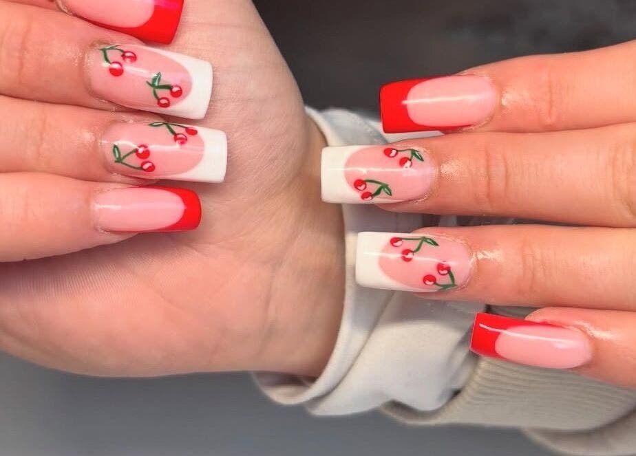 Vibrant cherry nail art at NAILHAUS, Halifax, England, GB. Perfect for a stylish and chic look.