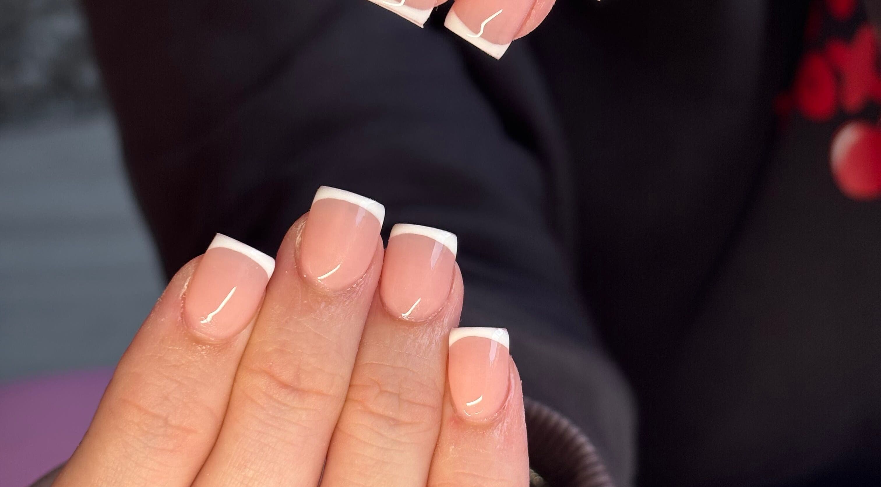Beautiful French tip nails at NAILHAUS, Halifax, England, GB salon showcasing expert nail artistry.