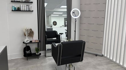 Modern styling chair at Ashleigh Jade Hairdressing, Blyth, England, GB with sleek decor and a large mirror.