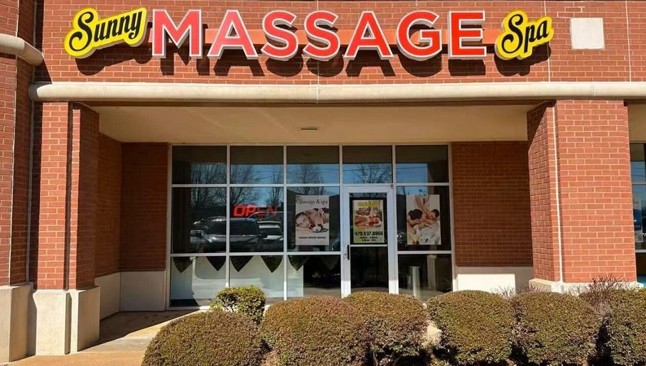 Front view of Sunny Massage Spa in Bentonville, Arkansas, US, showcasing its welcoming brick facade.