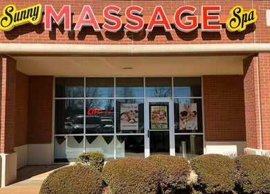 Front view of Sunny Massage Spa in Bentonville, Arkansas, US, showcasing its welcoming brick facade.