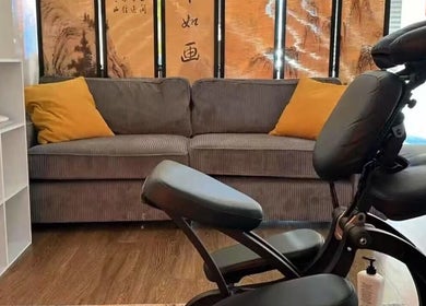 Cozy massage chair and sofa at Sunny Massage Spa, Bentonville, Arkansas, US. Ideal for relaxation.