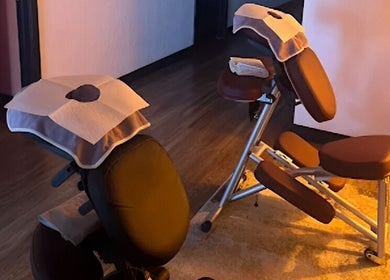 Cozy massage chairs at Sunny Massage Spa in Bentonville, Arkansas, US, offering a relaxing wellness experience.