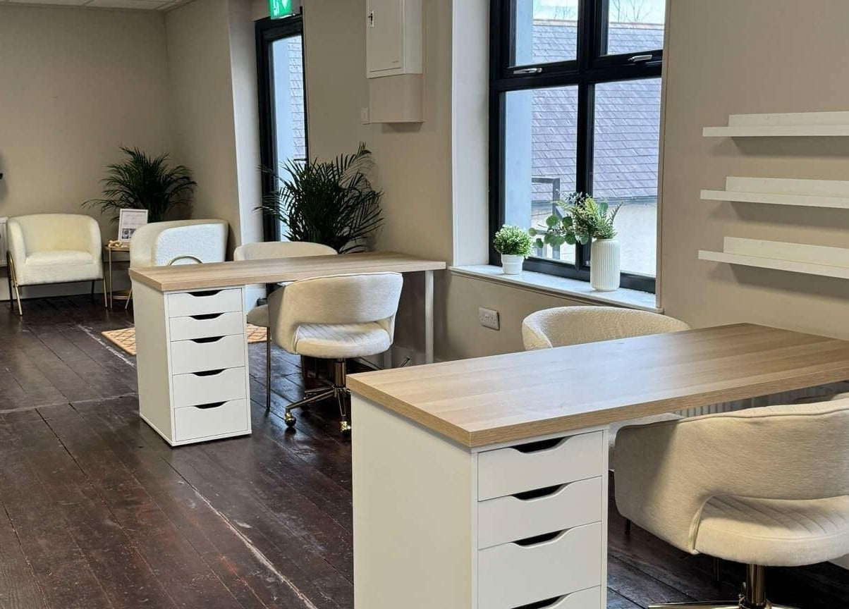 Modern nail salon interior at Loft Health & Beauty, Broughshane, Northern Ireland, GB, featuring chic workstations.