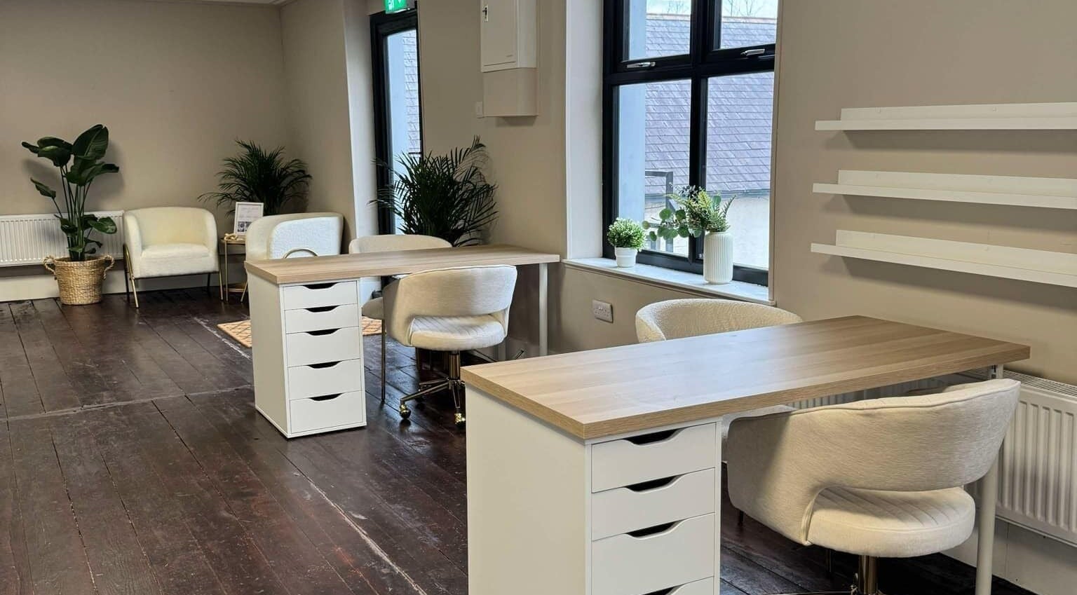 Modern nail salon interior at Loft Health & Beauty, Broughshane, Northern Ireland, GB, featuring chic workstations.