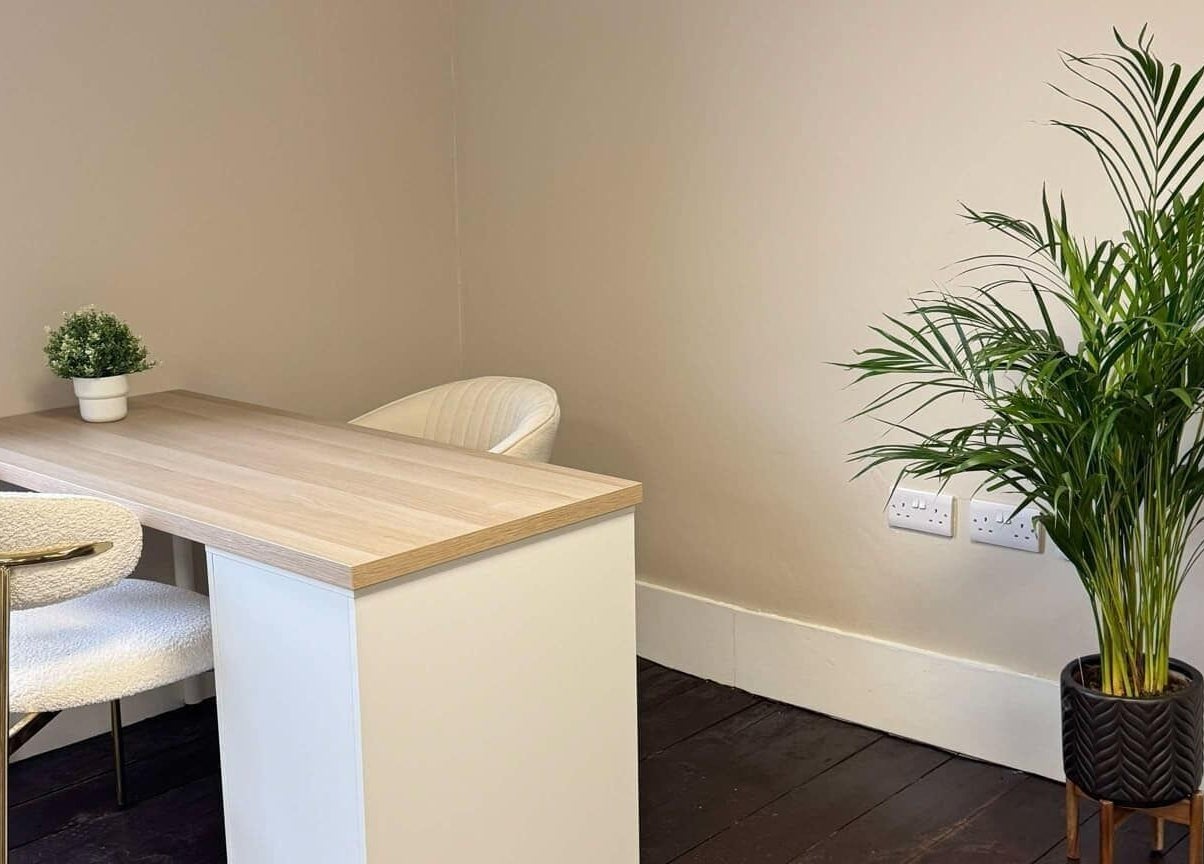 Relaxing office corner with a desk and plant at Loft Health & Beauty, Broughshane, Northern Ireland, GB.
