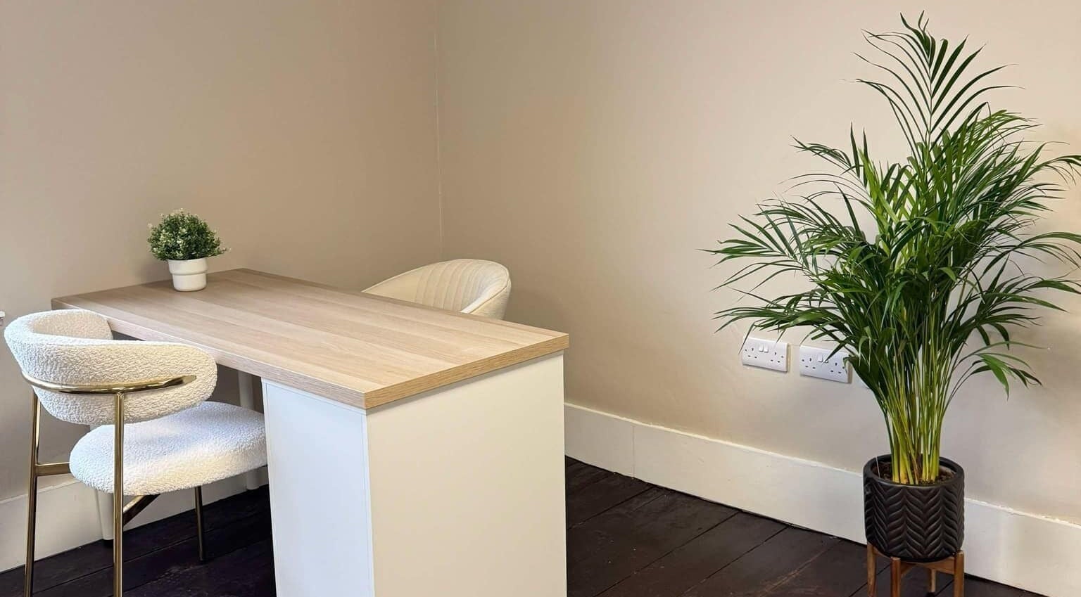 Relaxing office corner with a desk and plant at Loft Health & Beauty, Broughshane, Northern Ireland, GB.