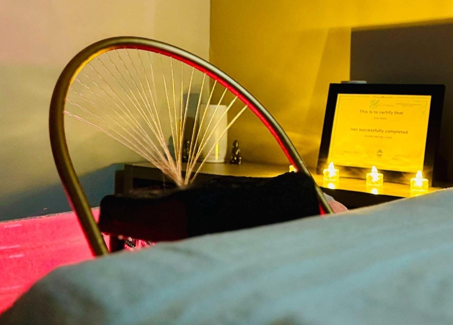 Relaxing therapy room at Loft Health & Beauty, Broughshane, Northern Ireland, GB with soft lighting and decor.