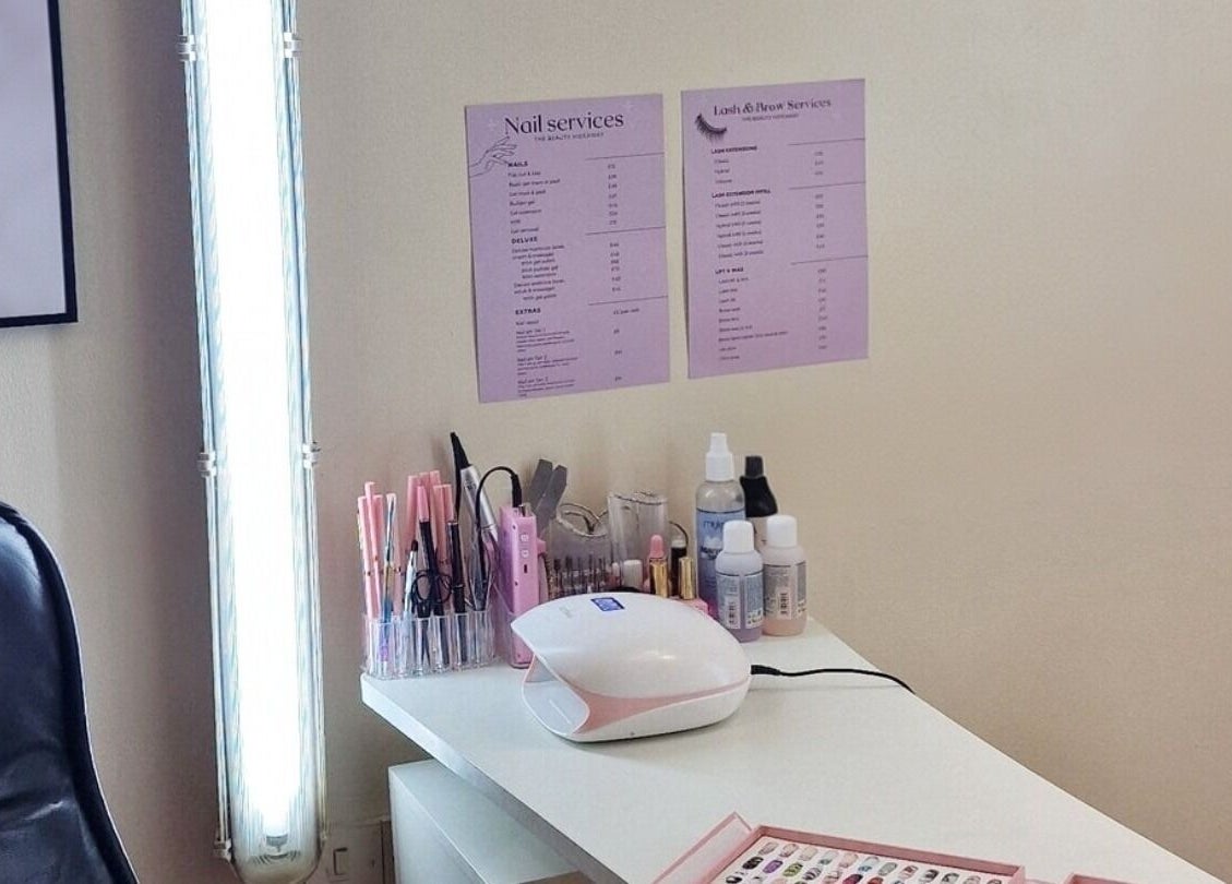 Nail service setup at The Beauty Hideaway, Ludlow, England, GB showcasing tools and service menus.