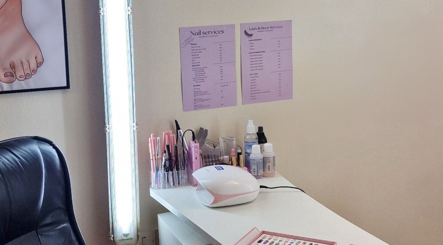 Nail service setup at The Beauty Hideaway, Ludlow, England, GB showcasing tools and service menus.