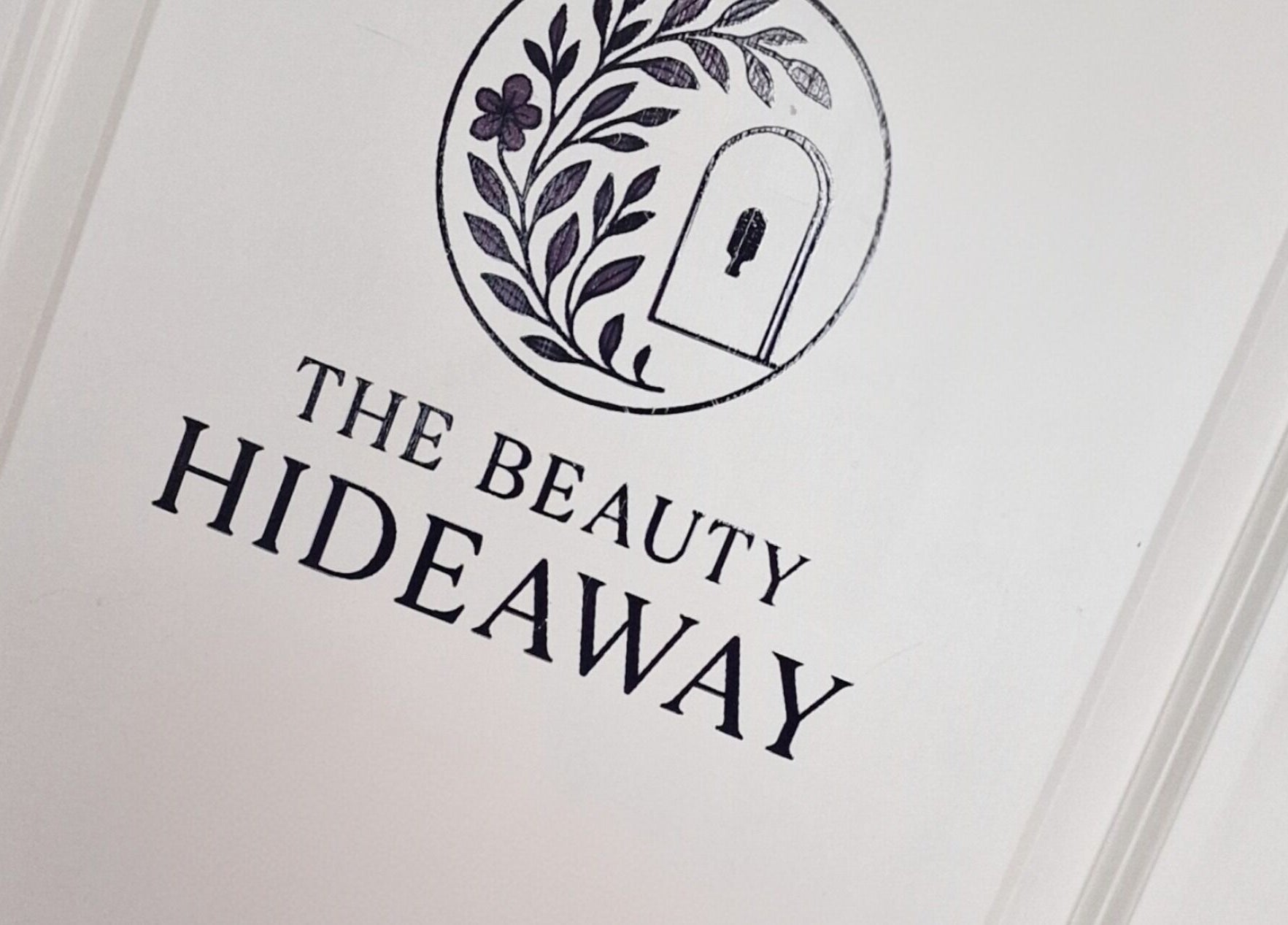 Elegant logo of The Beauty Hideaway; serene floral design in Ludlow, England, GB.