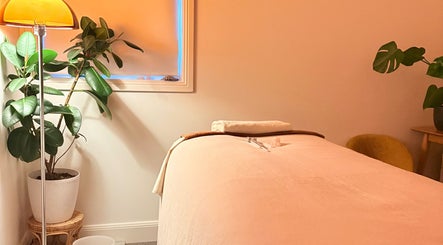 Tranquil massage room at Sound and Bodywork Massage in Melbourne, Victoria, AU with cozy décor and soft lighting.
