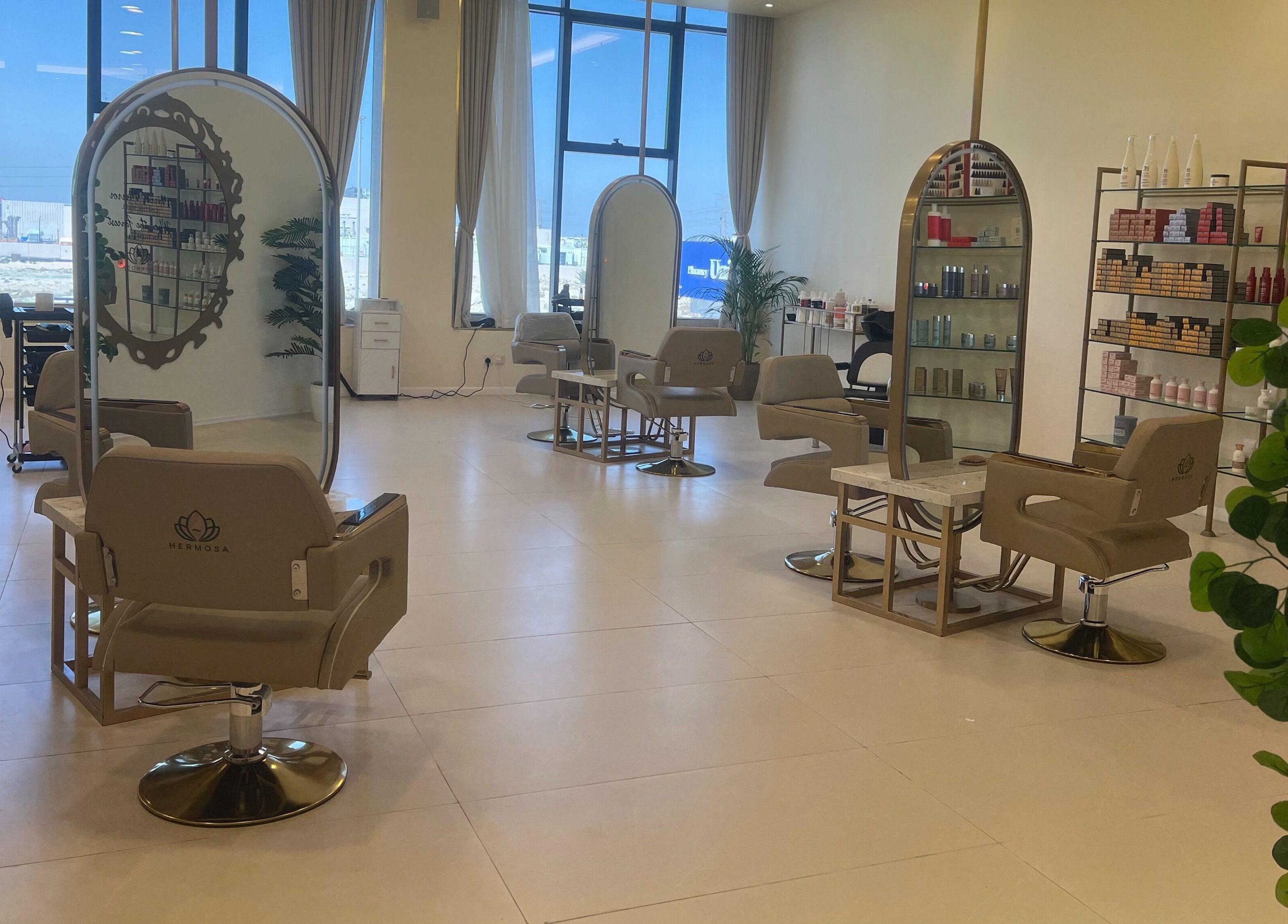 Chic interior of Hermosa Beauty Salon, Dhahran, Eastern Province, SA, featuring stylish salon chairs and bright lighting.