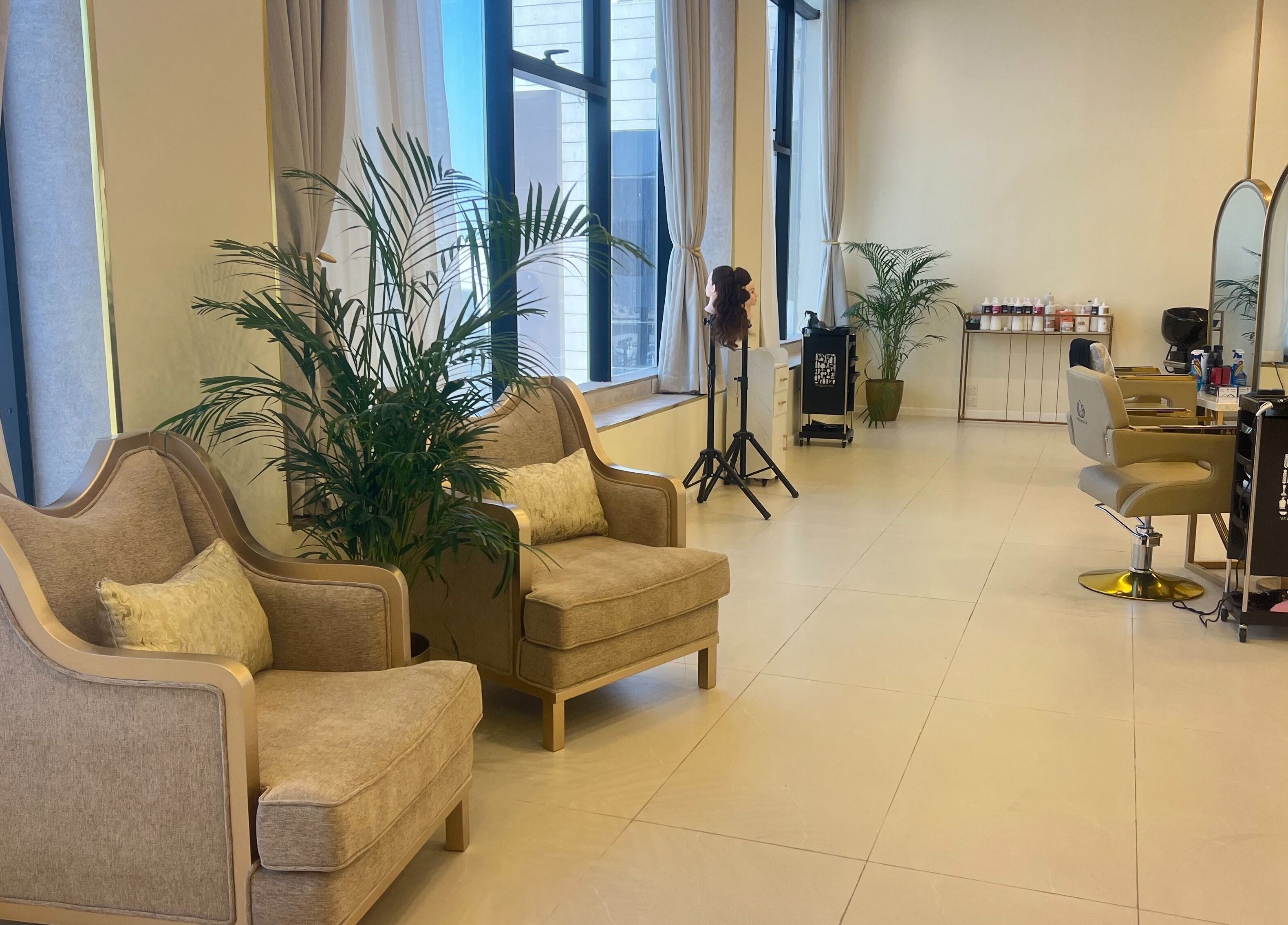 Stylish interior of Hermosa Beauty Salon in Dhahran, Eastern Province, SA with elegant chairs and mirrors.