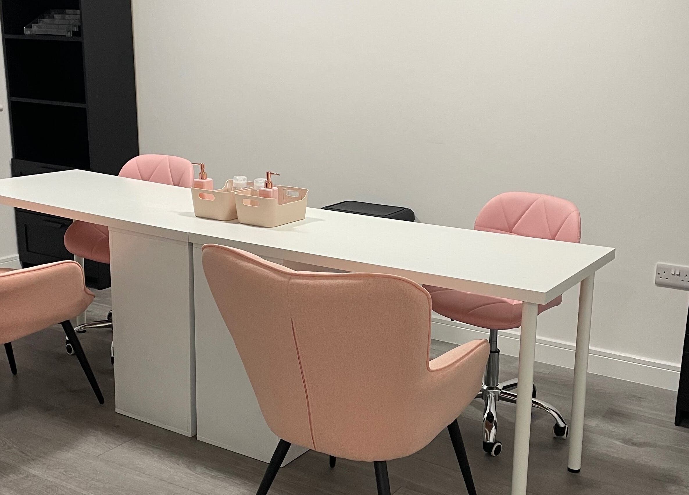 Chic pastel salon seating at CLB the salon, Winterbourne, England, GB, offering a relaxing atmosphere.