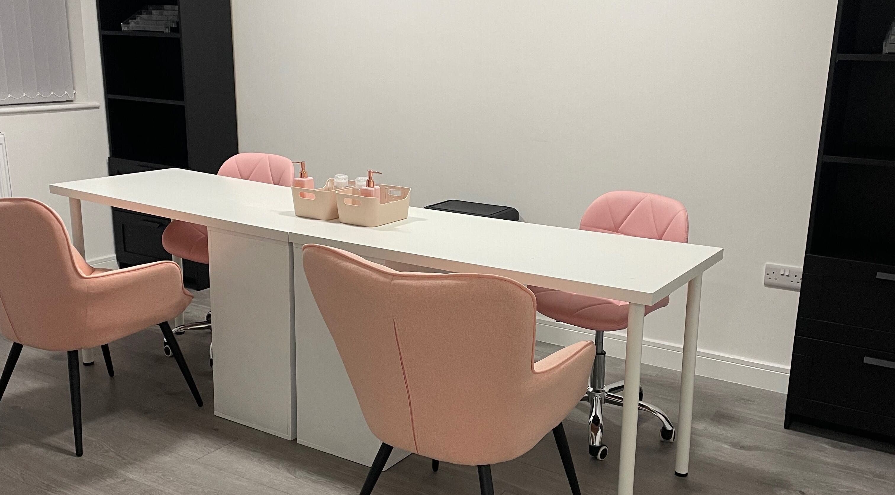 Chic pastel salon seating at CLB the salon, Winterbourne, England, GB, offering a relaxing atmosphere.