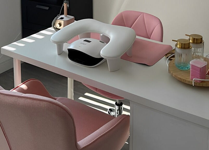 Modern nail station at CLB the salon, Winterbourne, England, GB with pink chairs and nail care tools.