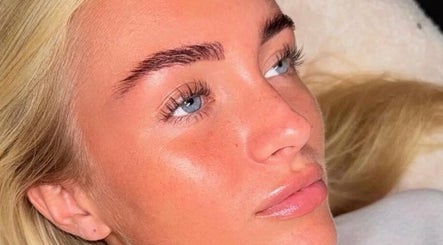 Close-up of a woman's glowing skin and styled brows at Dolled By Moll, Chislehurst, England, GB.